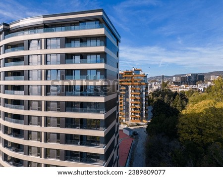 Similar – Image, Stock Photo Contemporary residential buildings and skyscrapers in city at sunset