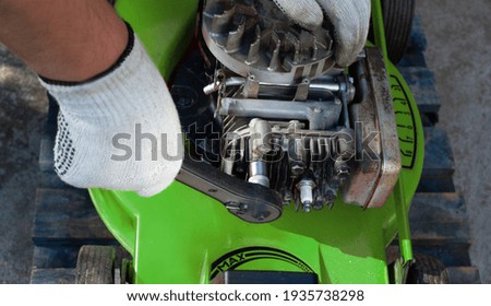Similar – Image, Stock Photo Repairman fixing old broken motorcycle in workshop