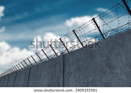 Similar – Image, Stock Photo barbed wire and concrete military fence on the beach near the sea in Crimea