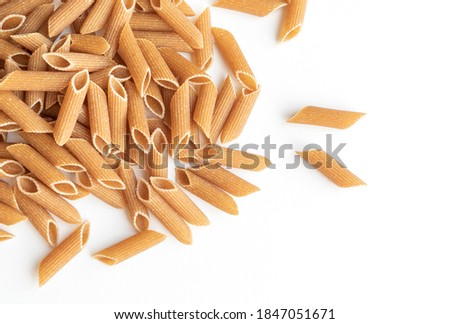 Top view pasta. Whole wheat pasta over white background Foto d'archivio © 