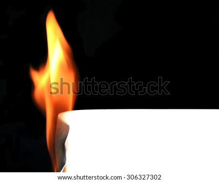 fire burn white paper on black background