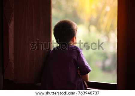 Similar – Image, Stock Photo young asia boy alone in the house