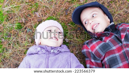 children happy smile brother sister lay ground