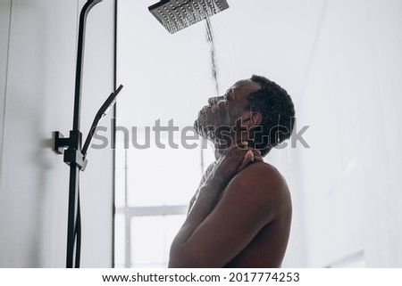 Similar – Image, Stock Photo Man taking shower in wooden bathroom