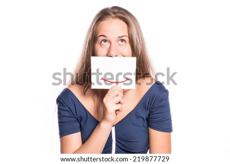 Young woman holding white board with smiley face on white isolated background