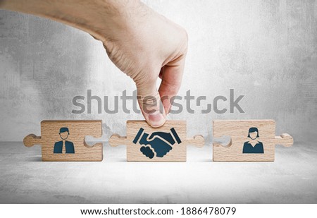 Wooden blocks with an icon of a woman and a man and mediation. Concept of mediation between spouses, divorce. Divorce proceedings before the Court. The role of the mediator.