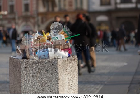 PRAGUE, CZECH REPUBLIC - MARCH 8th, 2014 - Litter bin on Old Town Square with people in background