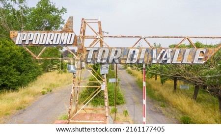 Closeup of entrance sign of the hippodrome of Tor di Valle in Rome, Italy. This stadium was an important horse racing venue and included a racetrack and right track. Now it's closed and abandoned Stock fotó © 