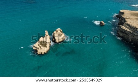 Similar – Image, Stock Photo The Two Sisters stacks in front of the shore of Torre dell’Orso