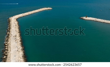 Similar – Foto Bild Langer Wellenbrecher im türkisfarbenen Meer an einem sonnigen Tag