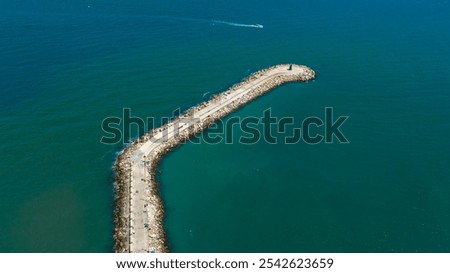 Similar – Foto Bild Langer Wellenbrecher im türkisfarbenen Meer an einem sonnigen Tag