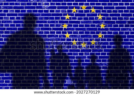 The refugees migrate to Europe union . Silhouette of illegal immigrants . Europe union migration policy