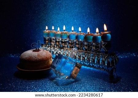 Jewish holiday Hanukkah background with menorah and dreidel with letters Gimel and Nun. Сток-фото © 