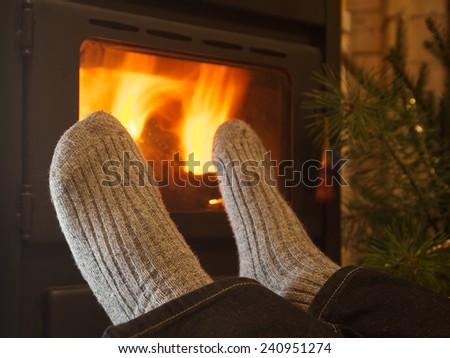 feet in stockings by the fireplace