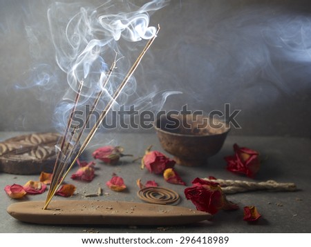 incense sticks with rose flowers leaves