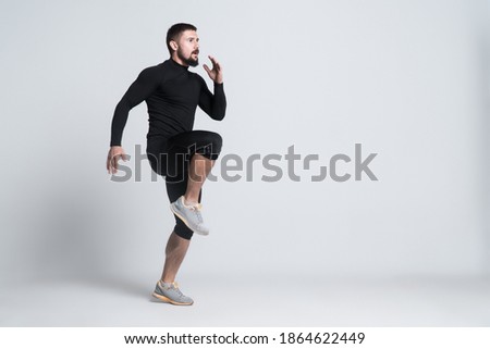 Similar – Image, Stock Photo Strong man exercising with dumbbells on bench