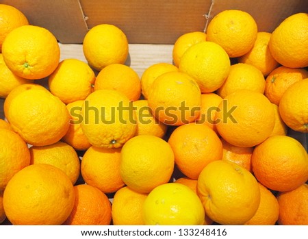 Citrus ripe orange fruits in box for sale, supermarket