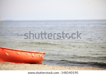 Beach life-saving. Lifeguard rescue equipment orange preserver tool boat, buoyancy aid