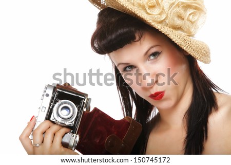 pretty retro summer funny girl in hat taking picture using vintage camera white background