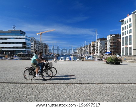 MALMO, SWEDEN - AUGUST 7 : Yachts and modern houses in marina on August 7, 2013 in a gulf of Malmo, Sweden.
