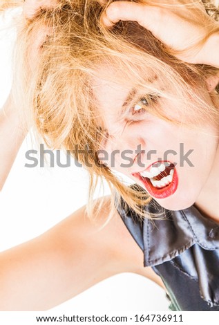 Angry messy businesswoman boss screaming with mouth wide open. Crazy mad girl messing up her hair. Trouble in work. Business concept. Studio shot. Isolated on white.