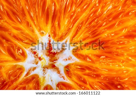 Closeup of orange fruit slice as food background or texture. Diet and healthy nutrition. Macro.