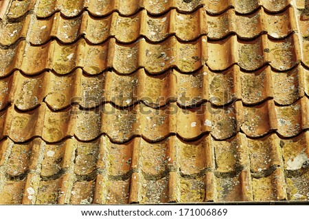 The old red clay roof tile background