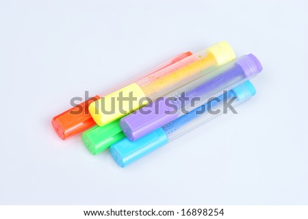 Colorful markers over a white background.