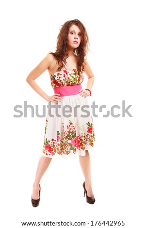 Full length of fashionable young woman. Girl in summer floral dress isolated. Fashion. Studio shot.