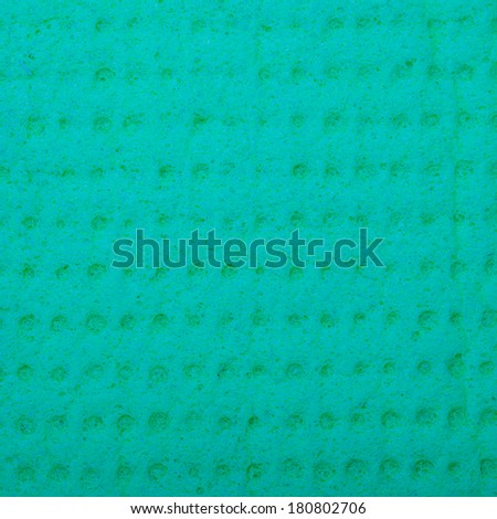 Closeup of vivid turquoise sponge as background texture pattern. Macro. Square format.