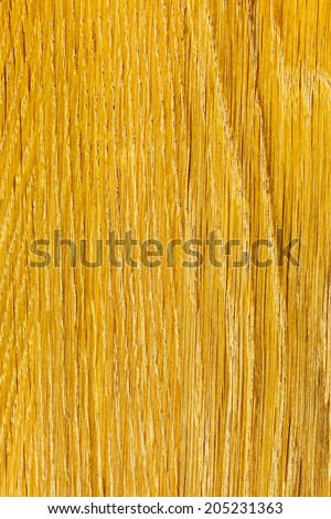 Closeup of wood. Brown yellow wooden plank as background texture backdrop. Macro