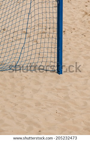 Football summer sport. closeup goal net on a sandy beach outdoor. active lifestyle