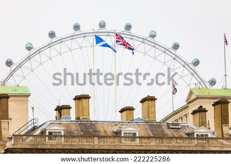 LONDON, ENGLAND UK - SEPTEMBER 20, 2014: London eye on September 20, 2014, England. The London Eye is a giant ferris wheel situated on the banks of the River Thames.