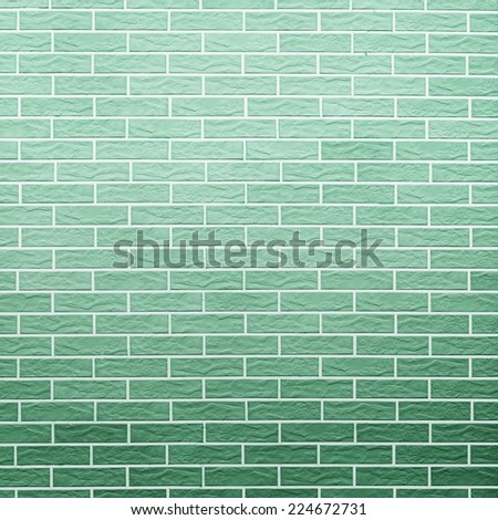 Architecture. Closeup of green brick wall as background texture or pattern. Square format