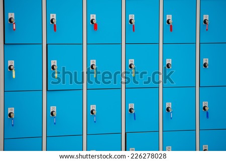 closeup blue deposite boxes with keys. left luggage checkroom background