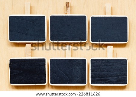 small blackboards slate chalk boards with space for text menu on wooden surface, empty blank sign