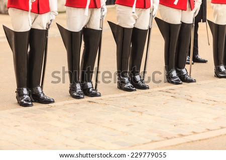 Royal horse guards at the Admiralty House in England. Part of body, solider boots