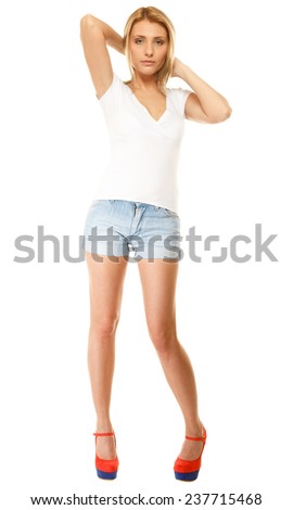 Summer fashion. Full length pretty young woman sensual girl in denim shorts, high heels isolated on white