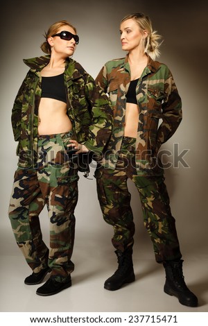 Full length two women in military clothes army girls on gray