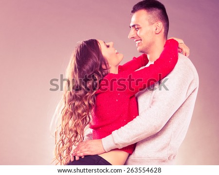Love dating and people concept. Smiling young couple looking each other, instagram filter