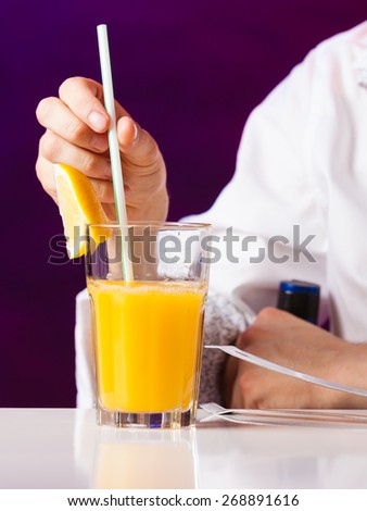 Young stylish man bartender preparing serving alcohol cocktail drink  over bar counter