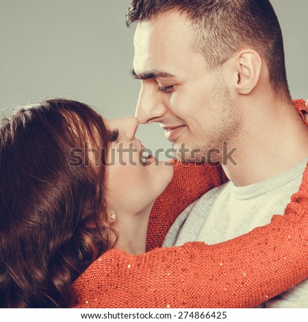 Portrait of young couple woman man face to face.