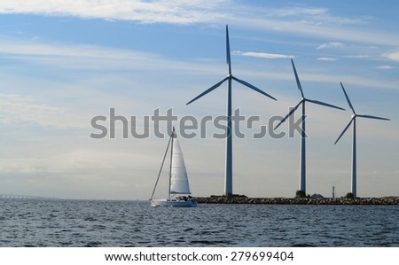 wind turbines power generator farm for renewable energy production along coast baltic sea near Denmark. Alternative green clean energy, ecology.