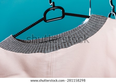 Fashion sale and retail concept. Closeup bright color tshirt casual style hanging on cloth hanger