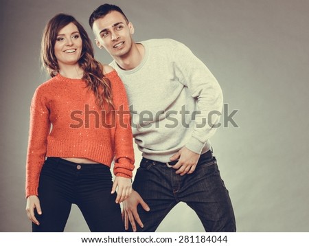 Love dating and people concept. Smiling young couple look to empty copy space ,instagram filter