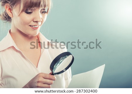 Business woman using magnifying glass to check contract instagram filter photo
