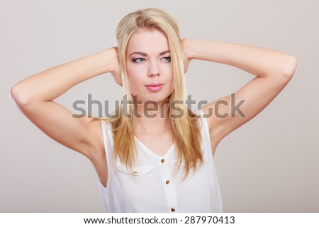 Negative human emotions, facial expressions, reaction attitude. Closeup stressed business woman covers ears with hands