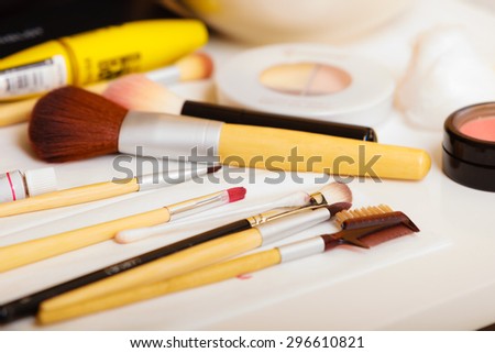 Beauty and makeup. Make up set  brushes and various decorative cosmetics on table