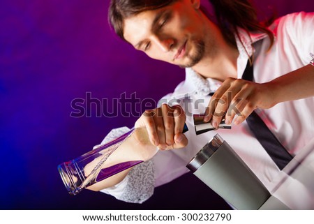 Young stylish man bartender preparing serving alcohol cocktail drink over bar counter