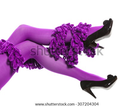Female fashion. Woman long legs color purple stockings high heels and warm scarf around leg isolated